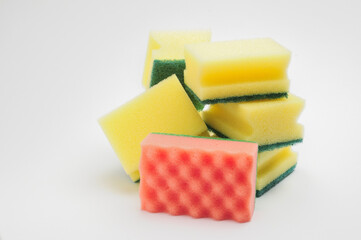 Sponge for washing dishes and plumbing on a white background