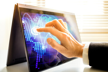 hand touching tablet screen global connection