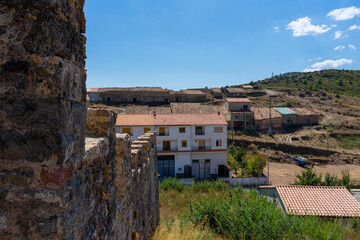 Fototapeta premium View of an old stone church in a rural mountain village. Selective focus