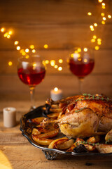 The Thanksgiving dinner with candles, red wine, turkey isolated on wooden background. Holiday concept. Festive mood.