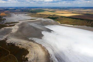 Amazing beauty of drying Kuyalnik estuary from bird's flight. Top view of coastal zone of ecological reserve Kuyalnik estuary, Odessa, Ukraine. Aerial view from drone to sea estuaries in suburban