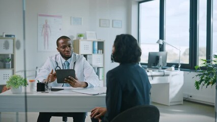 Family Doctor is Delivering Great News About Female Patient's Medical Results During Consultation in a Health Clinic