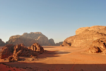 Fototapeta na wymiar Evening landscape of the Wadi Rum desert. Sandstone rocks and sand valley.