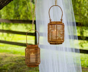 candles hanging in wicker basket