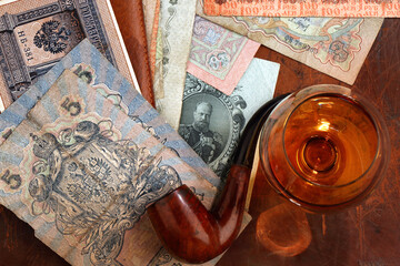 Russian money of the early twentieth century and a pipe for Smoking