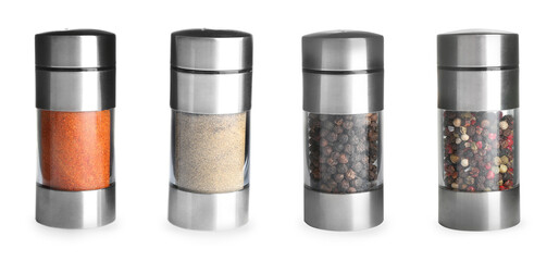 Shakers with red and white pepper powders near black, mixed peppercorns in grinders on white background © New Africa