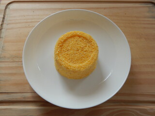 Traditional Brazilian couscous (cuscus/cuscuz). Tropical food. The Brazilian Couscous from the Northeast Region also known as Corn Couscous is a nutritious, cheap and a really simple recipe to make.