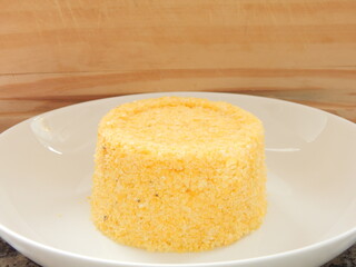 Traditional Brazilian couscous (cuscus/cuscuz). Tropical food. The Brazilian Couscous from the Northeast Region also known as Corn Couscous is a nutritious, cheap and a really simple recipe to make.