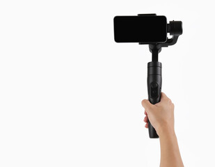 Gimbal. Hand holding mobile phone stabilizer on white background