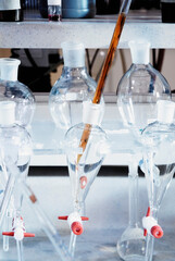 Close-up of a pipette in a separating funnel