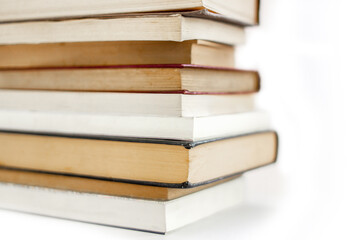 stack of old and new books view from the side