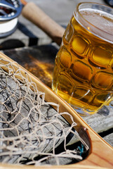 Close-up of a fishing net and a glass of beer