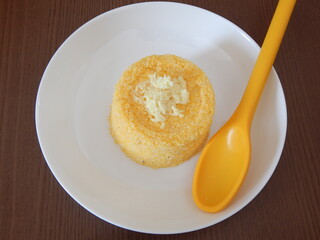 Traditional Brazilian couscous (cuscus/cuscuz). Tropical food. The Brazilian Couscous from the Northeast Region also known as Corn Couscous is a nutritious, cheap and a really simple recipe to make.