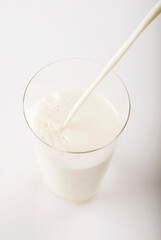 Milk being poured in a glass