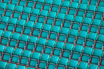 Naklejka premium High angle view of empty blue chairs in a stadium 