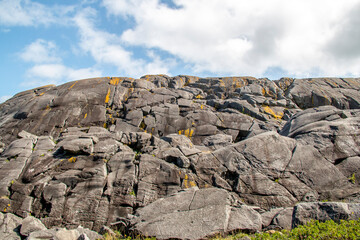 Rocky coast by the edge of the ocean in summer