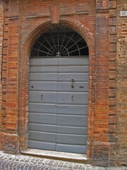 Italy, Marche, Ostra typical medieval building door.