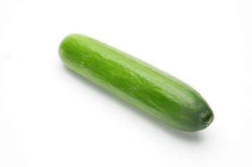Ripe cucumber on a white background