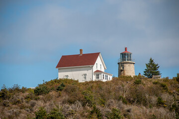 Fototapeta na wymiar Stone lighthouse on Monhegan Island Main Unites States