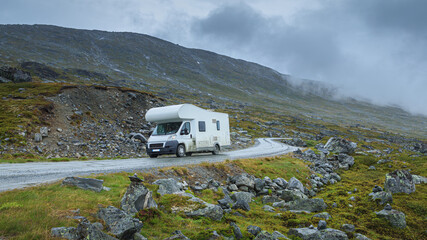 motorhome rides on a mountain road