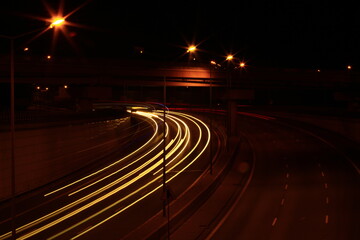 streaks of car lights on the street at night