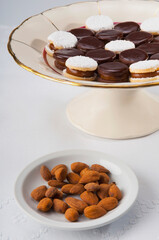 Chocolate cream cookies served with almonds