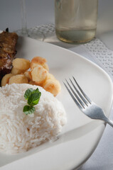 White rice with fritters and basil leaves