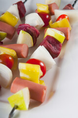 Close-up of sausage and cheese skewers