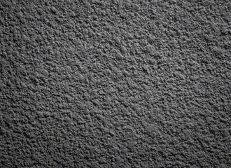 Dark gray concrete wall, texture
Dark gray concrete wall, texture, background with darkened edges, close-up side view.