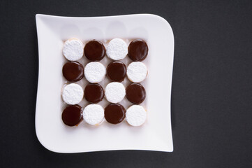 High angle view of chocolate cream cookies on a tray