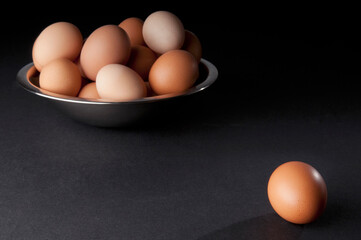 Close-up of a bowl of brown eggs