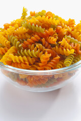 Close-up of a bowl of uncooked fusilli