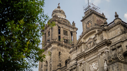 Fototapeta na wymiar Cathedral of Mexico City and One of Its Bell Towers under a Blue Sky