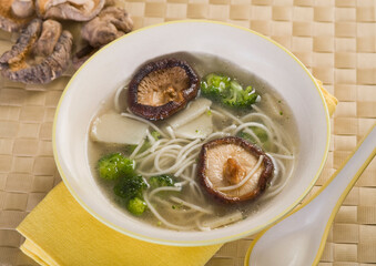 High angle view of a bowl of mushroom and noodle soup