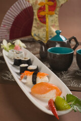 Close-up of japanese food with hand fan
