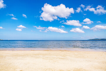 Tropical sandy beach and blue ocean, blue sky background image for nature background or summer background.