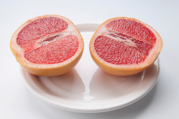 High angle view of two grapefruit halves in a plate