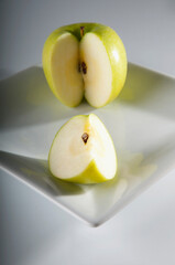 Close-up of granny smith apples on a plate