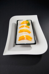 Close-up of a mango and coconut dessert