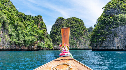 Traditional longtail boat with beautiful scenery view Loh samah bay Phi Phi island Beautiful island in Thailand.