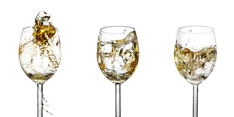 Set of three glasses with a splash of white wine