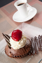 Chocolate tart served with a cup of black coffee