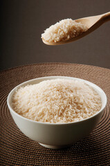 Close-up of uncooked rice in a ceramic bowl