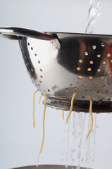 Close-up of boiled spaghetti in a strainer