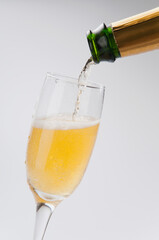 Close-up of champagne pouring into a glass