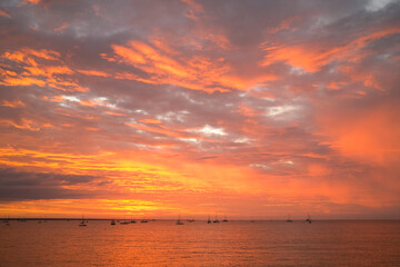 Moored sailing boats and yacht in Darwin Harbour at sunset. Darwin, Northern Territory, Australia.
