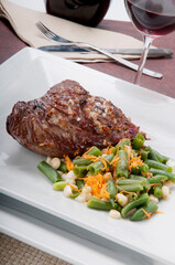 High angle view of steak served with green beans