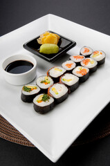 High angle view of sushi with soy sauce and wasabi paste