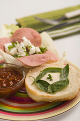 Close-up of a salami and basil sandwich
