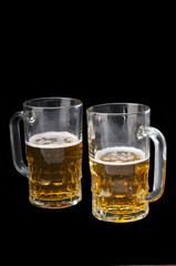 Close-up of two mugs of beer
